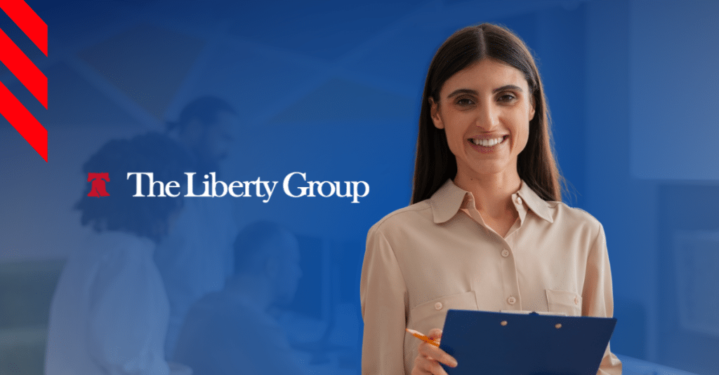 A property management staff holding a clipboard beside The Liberty Group logo.
