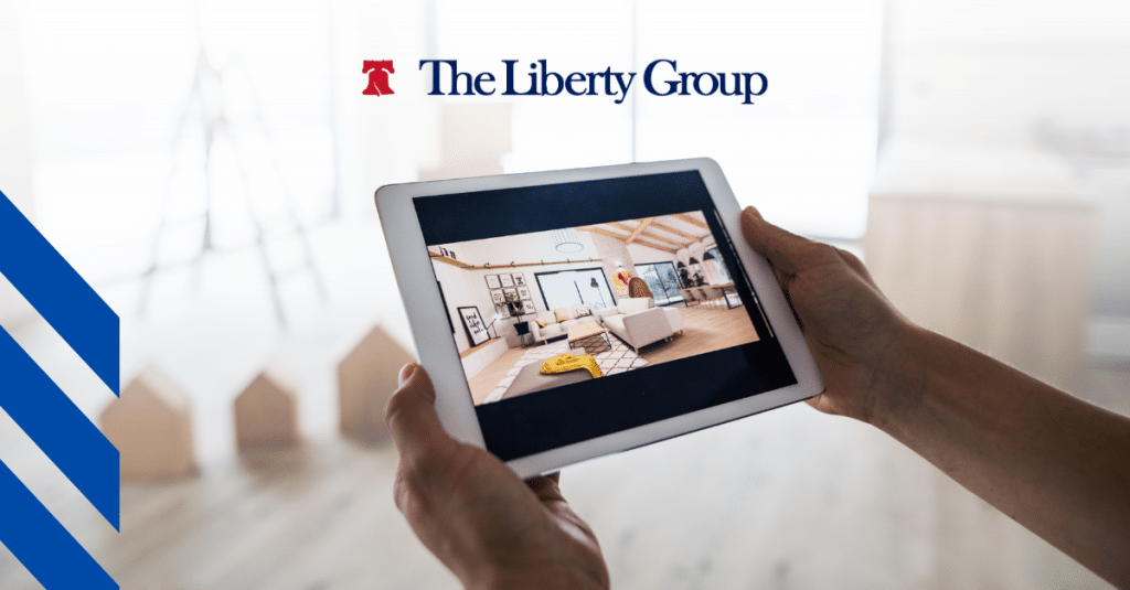 A pair of hands hold up a tablet showcasing a virtual tour of a property; The Liberty Group logo is at the top center.