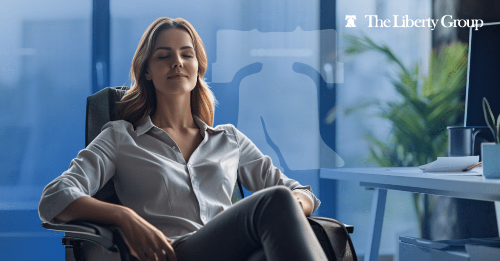 Professional woman relaxing in office chair, symbolizing reduced employee burnout in property management.
