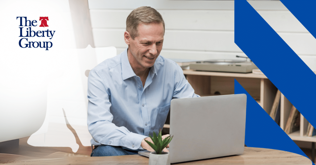 Property management professional reviewing career goals on laptop.