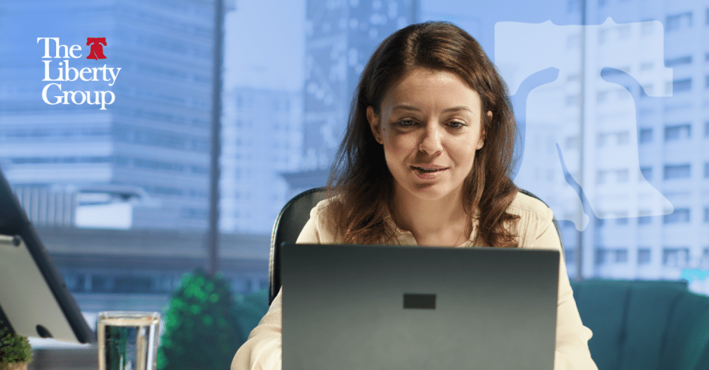 Property management professional reviewing certifications on a laptop