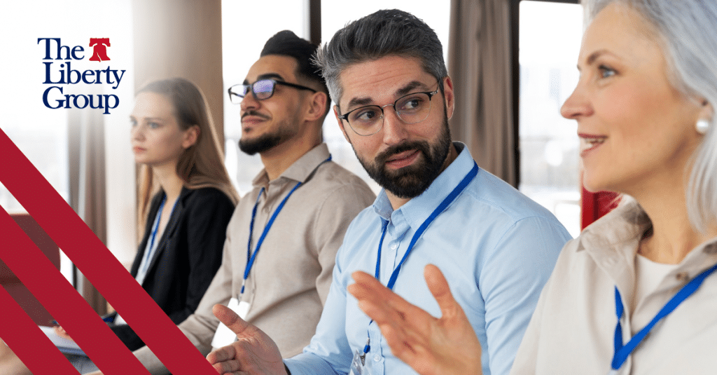A man speaks during a group discussion at a year-end reflection meeting.